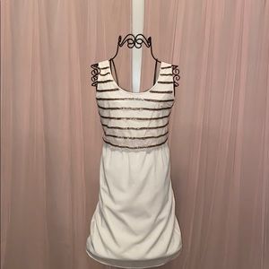 Francesca’s cream and studded gold dress